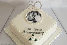 a 50th anniversary cake with an image of a couple on it