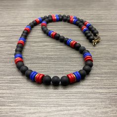 This necklace is made of 7mm round matte black onyx stone beads, 8mm blue and red ceramic rondelle beads and brass oxide heishi rondelle beads. It has a brass oxide lobster claw style clasp and wire guards. Available in lengths of 20-28 inches. Prices vary. Matching Bracelet: https://www.etsy.com/listing/1464529529/men-haitian-flag-inspired-with-brass Black Heishi Beads Jewelry, Black Heishi Beaded Necklaces, Haitian Flag, Red Ceramic, Fredericksburg Va, Ceramic Necklace, Black Onyx Stone, Matching Bracelet, Onyx Stone