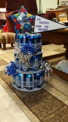 a birthday cake made out of soda cans