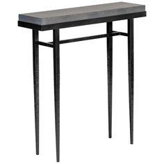 a black console table with metal legs