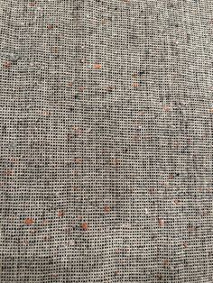 an upholstered fabric with small dots on it