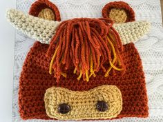 a crocheted hat with an animal's head on it