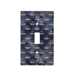 a decorative light switch plate cover in blue and gold