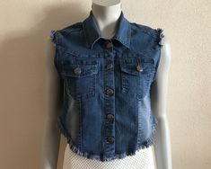 "Women's Vest Denim Vest Blue Denim Vest Jeans Vest Fitted Womens Waistcoat Vests Country Western Boho Womens Top Sleeveless Denim Jacket  Label size: 40 Measurements (lying flat): Length(back): 14.5\"/ 37 cm Pit to pit: 17.5\"/ 44.5 cm Waist: 16.5\"/ 42 cm Please check measurements to insure a proper fit. Remember to allow yourself some extra room for movement. You can compare these with something from your closet that fits you well. Please convo me if you need additional measurements. Conditio Spring Denim Blue Buttoned Vest, Medium Wash Denim Vest Top For Fall, Fall Medium Wash Denim Vest Top, Spring Denim Vest Jacket, Spring Dark Wash Vest With Buttons, Sleeveless Denim Blue Jacket For Spring, Spring Dark Wash Denim Vest Top, Sleeveless Denim Jacket For Spring, Trendy Spring Denim Vest With Buttons