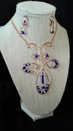 "Fleur-de-lis inspired necklace & earrings, handmade of copper wire, cobalt blue Czech crystal  beads with silver accents. Necklace focal piece is 4\" long and 3-1/4\" wide. It is adjustable to hang at choker length or below, 13-1/2\" total length. Earrings have 1-1/4\" drop. Additional coordinating earrings available under separate listings For new work, please follow me on Instagram #noladreamers" Blue Beaded Copper Jewelry, Unique Blue Copper Wire Necklaces, Blue Copper Wire Wrapped Necklaces, Blue Copper Wire Wrapped Necklace, Blue Wire Wrapped Copper Earrings, Nickel-free Blue Copper Jewelry, Elegant Blue Copper Jewelry, Blue Beaded Copper Necklace, Blue Wire Wrapped Metal Necklace