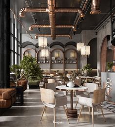 the interior of a restaurant with tables, chairs and couches in an industrial style