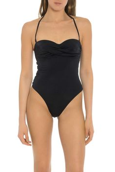 This classy, elegant, and simple one-piece swimsuit is the perfect choice for your next beach visit. Features: This one-piece swimsuit is simple but includes beautiful detail. This swimsuit has a halter style tie to keep it in place. This piece of swimwear offers four-way stretch and is fully lined. If you are looking for a one-piece swimsuit, this is a great choice. The classic and simple style offers a touch of elegance. This Carmen Sol swimsuit comes in two simple colors. Add this swimsuit to Solid Swimwear With Knotted Straps For Vacation, Solid Color Swimwear With Knotted Straps For Beachwear, Solid Color Swimwear With Knotted Straps For Poolside, Solid Swimwear With Knotted Straps For Poolside, Backless Ruched Bodysuit For Beach, Elegant Triangle Top Stretch Swimwear, Fitted Backless Swimwear With Knotted Straps, Elegant Pool Tankini With Built-in Bra, Elegant Triangle Top Swimwear For Beach Season