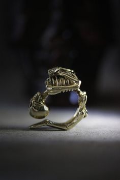 * Human skeleton ring original design and made by Defy ** The human skeleton is great details made, posture in round circle for it can fit to fingers. The ring material is brass. - The human skeleton dimensions : approx. 3 x 2.2 x 1.2 cm. - The ring size is available between 7-9 US. - Material : Brass / Silver **Shipping to World Wide** - Please allow us to prepare the item and parcel between 3-5 working days. For Brass / Silver plated / Gold plated (*Between 5-7 working days For Sterling Silver Skeleton Ring, Human Skeleton, Dark Style, Jewelry Design Inspiration, Special Ring, Jewelry Tags, Rings Necklaces, Jewellery Design, Ring Jewelry