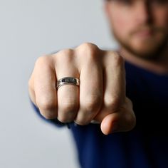 This ring is forged with high quality stainless steel and looks amazing on any guys hand. Don't know your ring size? Go here: etsy.com/listing/769243955/finger-ring-sizer-by-modern-out US Sizes 9, 10, 11, 12 7mm thick Made of stainless steel ► For longer lasting quality, please keep jewelry dry and away from chemicals. Jewelry care instructions come with every order. ► International orders are subject to tax/duty fees. This is uncontrollable on our end. Shipping can take up to 6 weeks due to cus Silver Titanium Promise Ring, Minimalist Engraved Stainless Steel Rings, Titanium Promise Ring, Classic Titanium Jewelry For Gifts, Stainless Steel Engraved Ring With Polished Finish For Promise, Stainless Steel Polished Engraved Promise Ring, Durable Silver Promise Ring, White Gold Titanium Rings For Gift, White Gold Titanium Promise Ring