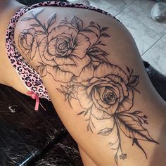 a woman's thigh with roses on it