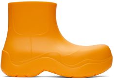 Ankle-high waterproof rubber boots in orange. · Bonded jersey lining · Treaded rubber sole Supplier color: Tangerine | Bottega Veneta Orange Puddle Boots Puddle Boots, Orange Boots, Shoes Boots Ankle, Shoe Boutique, Hot Sneakers, Rubber Boots, Black Leather Boots, Shoe Game, Bottega Veneta