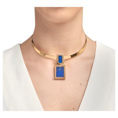 Modernist stylish design signed on the back Reyes 1973 Beautiful hand crafted as art piece of jewelry of solid 18 KT With a flat and wide torque more suitable for a long slim neck and two geometric forms of substantial gold set with high quality beautifully polished Lapis for an amazing effect Fine condition keeping with age An unique expression of design and style of the 70’s Further Details Below Metal: 185 Kt yellow gold, tested Hallmarks: signed REYES 1973 Gems: 2 natural lapis inlay of 15 x 7 mm and 21 x 16 mm Measures: pendant is 51 x 22 mm (h. x w.) width of the necklace is 6 mm – circumference 37 cm Weight: 42.2 grams Condition: very good commensurate to age and use Luxury Modernist Necklace With Large Pendant, Slim Neck, Geometric Forms, Geometric Form, Gold Set, Sign Design, Beautiful Hand, Stylish Design, Jewelry Necklace Pendant