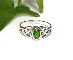 My Celtic Emerald Green CZ Gemstone ring was created in solid Sterling Silver. The front of the ring is set with an oval faceted Emerald green cubic zirconia cab and is framed with a Celtic Trinity knot on each side of the stone. The face of the ring measures 8mm or .31 inches. Please select your size from the drop down menu.~The color in this ring is a true Celtic or Irish green and is the birthstone for May.~The Celtic Trinity or Triquetra symbolizes the "Trine" or the "Three". It consists of Green Birthstone Ring For Promise, Green Opal Promise Ring, Adjustable Green Crystal Promise Ring, Adjustable Green Crystal Ring For Promise, Garnet Earrings Silver, Emerald Green Ring, Silver Solitaire Engagement Ring, Crown Engagement Ring, January Birthstone Jewelry