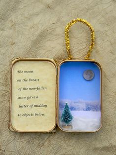 an open box with a small christmas tree in it and a quote on the inside