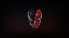 a spider man mask is shown in the dark