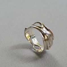 Silver frames stunning opal in this bold and elegant piece. This ring captures the liquidity of forms, as one shape flows into another. An excellent gift for the winter holidays, with its cool, mesmerizing colors. Pair with our Silver and Opal Earrings for the perfect set! Available separately: https://www.etsy.com/il-en/listing/654061483/opal-swirl-earrings-silver-and-opal?ref=shop_home_active_1 -- To see more items from RethinkGold, please visit us at https://www.etsy.com/il-en/shop/RethinkGol Elegant Opal Open Ring With Polished Finish, Elegant Polished Opal Open Ring, Opal Open Ring With Polished Finish For Anniversary, Elegant Open Ring Jewelry With Unique Variations, Unique Open Band Jewelry With Polished Finish, Anniversary Opal Open Ring With Polished Finish, Elegant Polished Opal Ring Gift, Elegant Polished Opal Ring For Gift, Gold Sterling Silver Opal Ring With Polished Finish