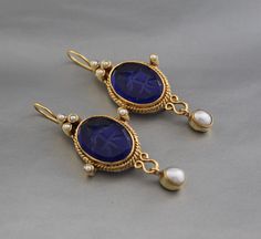 Description Gemstone - Indigo Blue Glass Material - Brass Gemstone Size - 13X18 mm Earring Height Including Hoop - 4.5 cm Earring Width - 2.5 cm Finish - Smooth and high polished with brilliant shine Note -The earrings are made to order, production day is about 3-5 working days. The one you receive may be slight different from the one in the picture due to handmade nature, but it will be almost same as in the above picture.These pieces are handcrafted from start to finish and have an imperfect h Blue Pendant Earrings For Wedding, Blue Round Clip-on Jewelry, Blue Gemstone Pendant Earrings, Blue Clip-on Earrings For Gift, Blue Clip-on Earrings For A Gift, Blue Gemstone Pearl Drop Earrings, Blue Pendant Earrings For Gift, Blue Oval Clip-on Earrings, Jewlery Rings