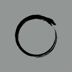 a black circle drawn in ink on a gray background