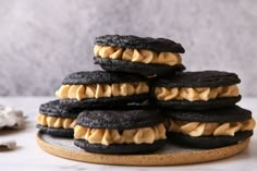 a stack of cookies with peanut butter on top