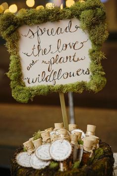 two photos one has a sign and the other is an image with words on it that read spread the love and plants wildflower seeds in mini corks