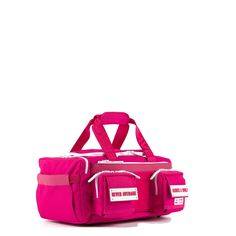 a pink duffel bag sitting on top of a white floor