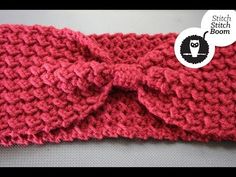 a crocheted headband with a bow on it