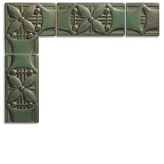 four green tiles are arranged in the shape of an interlocked flower and leaf