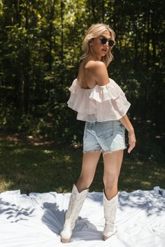 Our Elle Ruffle Top features ruffled tiered detail and an off-the-shoulder design. True to Size 100% Polyester Hand Wash Cold, Hang Dry Feminine Off-shoulder Top With Ruffles For Summer, Spring Off-shoulder Ruffle Top, Off-shoulder Top With Ruffles For Brunch, Feminine Pink Off-shoulder Top For Summer, Summer Off-shoulder Top With Ruffle Hem, Chic Ruffled Off-shoulder Top For Day Out, Pink Off-shoulder Top For Summer Day Out, Off-shoulder Top With Ruffle Hem For Summer, Off-shoulder Tops With Ruffle Hem For Summer