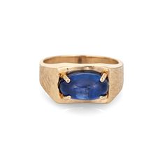 "Stylish vintage natural Ceylon star sapphire ring crafted in 14 karat yellow gold (circa 1970s).  Natural star sapphire, approx. 5.30ct (12.1 x 7.0 x 5.8mm), medium-dark blue color, lightly included, high polish. A faint star is visible under a pinpoint light source. Color and inclusions are typical of star sapphires from Ceylon (Sri Lanka). There is no evidence of any treatments to the stone.  Set in an east to west position, the star sapphire glows in natural sunlight. The gemstone is securely prong set with a florentine finish to the side shoulders. The ring makes a nice statement on the hand. The medium rise ring (7.5mm - 0.29 inches) sits comfortably on the finger.  Included is a report from Guild Laboratories with an \"Estimate of Retail Selling Price New for Comparison Purposes\" - Classic Sapphire Oval Cabochon Jewelry, Modern 14k Gold Collectible Jewelry, Collectible Modern 14k Gold Jewelry, Collectible Oval Sapphire Jewelry, Vintage Sapphire Birthstone Jewelry, Collectible 14k Gold Sapphire Ring With Gemstone, Collectible 14k Gold Sapphire Ring, Collectible Sapphire Ring In 14k Gold, Vintage Yellow Gold Sapphire Jewelry, Oval Cabochon