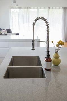 a kitchen with a sink, faucet and counter top