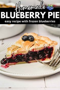 blueberry pie on a plate with a fork