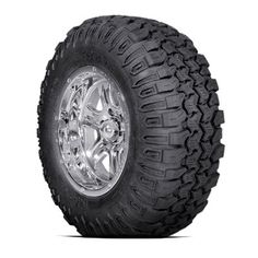 an all terrain tire with chrome rim and spokes