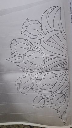 a drawing of flowers is shown on top of a piece of paper with lines in the background