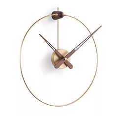 a gold clock with two brown hands on a white background