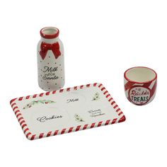 a set of christmas themed items including a mug and saucer