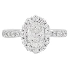 an oval cut diamond ring set in 18k white gold