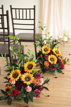 flowers are arranged on the floor in front of chairs