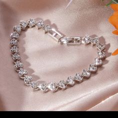 Heart Silver Plated Rhinestone Tennis Bracelet Heart Shaped Bracelet New This Is A Beautiful Elegant Heart Shaped Rhinestone Bracelet That Is Silver Plated! I Ship Items Out Every Day! Expect To Receive This Bracelet As Soon As Possible! Elegant Silver Heart Bracelet With Rhinestones, Silver Rhinestone Bracelets For Valentine's Day, Silver Crystal Heart Bracelet For Wedding, Valentine's Day Silver Bracelets With Rhinestones, Valentine's Day Silver Bracelet With Rhinestones, Heart-shaped Rhinestone Bracelets For Party, Heart Shaped Rhinestone Bracelet For Parties, Heart-shaped Rhinestone Party Bracelets, Heart-shaped Rhinestone Bracelet As Gift