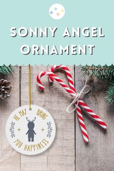 a christmas ornament with candy canes on it and the words, sohny angel ornament