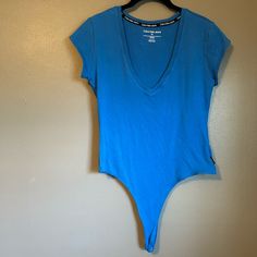 New Without Tags. See Pics For Condition And Measurements. Stretch V-neck Bodysuit For Workout, Trendy Blue V-neck Bodysuit, Casual V-neck Bodysuit For Loungewear, V-neck Stretch Bodysuit For Workout, Casual Blue Scoop Neck Bodysuit, Blue Scoop Neck Bodysuit For Spring, Blue Stretch Cotton Bodysuit, Low-cut Blue Summer Tops, Casual Fitted V-neck Bodysuit