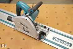 a makita saw is sitting on top of a table