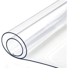 a roll of clear plastic wrapping paper on a white surface with a black circle at the end