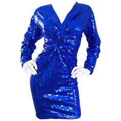 Sexy 1990s OLEG CASSINI royal blue sequined mini dress! Features thousands of hand-sewn royal blue sequins on s stretch jersey fabric. Flattering ruching at center bodice. Hidden zipper up the back with hook-and-eye closure. Fully lined. Great with heels or boots. In great condition. Made in USA Approximately Size Small - Medium (tons of stretch) Measurements: 34-38 inch bust 26-30 inch waist 34-40 inch hips 37 inches from top back shoulder seam to hem Fitted Royal Blue Mini Dress With Sequins, Fitted Royal Blue Sequin Mini Dress, Royal Blue Sequin Mini Dress For Night Out, Ugly Fashion, Sequined Mini Dress, Long Sleeve Cocktail Dress, Cocktail Dress Vintage, Oleg Cassini, Evening Dresses Cocktail