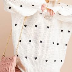 SWEATER WEATHER 🖤 HEARTS Warm ivory knit sweater with black heart detail Ribbed trim, cuffs, & hem Oversized, relaxed fit Fits true to size 85% Acyrlic, 15% Polyester Available in standard & plus sizing Measurements approximately: Small: Bust 48", Waist 30", Length 25" Medium: Bust 52", Waist 32", Length 25.5" Large: Bust 56", Waist 34", Length 26" White Heart Sweater For Winter, White Heart Print Sweater For Winter, White Heart-shaped Sweater For Spring, Oversized Heart-shaped Sweater For Winter, Oversized Heart Print Sweater For Fall, White Trendy Sweater With Heart Print, Trendy White Sweater With Heart Print, Casual White Heart Print Sweater, White Casual Sweater With Heart Print