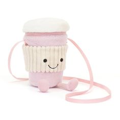 a pink cup with a smiling face on it