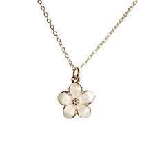 The Magnolia Bloom Necklace encapsulates nature's delicate beauty. Each petal is adorned with a shimmering white enamel, evoking dew-kissed morning blooms. The pendant hangs from an adjustable chain, allowing for personalized length and style. This necklace embodies the magnolia's symbolism of purity, femininity, and endurance. Whether worn as a statement piece or a cherished gift, it brings a touch of timeless elegance to any ensemble. The necklace is perfect for any occasion and would make a g Elegant White Flower Necklace With Birth Flower Detail, Nature-inspired White Jewelry With Birth Flower, Elegant White Flower Necklace For Birth Month, White Nature-inspired Jewelry With Birth Flower, Elegant White Flower Necklace For Birthdays, Elegant White Birth Flower Necklace, White Petal-shaped Jewelry With Flower Charm, White Birth Flower Pendant Necklace, White Delicate Birth Flower Jewelry