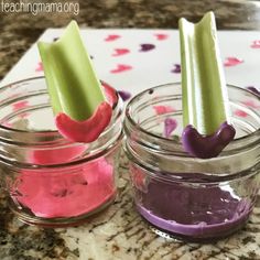 two jars filled with purple and green food