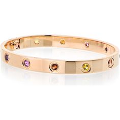 Dive into the depths of luxury, where craftsmanship meets creativity in this stunning Cartier Love 18K Rose Gold Rainbow Bracelet. Encased in the warmth of 18K rose gold, this iconic piece brings the vibrant hues of a rainbow to life, capturing the essence of joy, love, and elegance. Each gem embedded around the bangle is a celebration of color, creating a mesmerizing display that transitions seamlessly from deep greens to rich reds, yellows, and purples. The bracelet's seamless screw motif adds Luxury Multi-stone Gold Bracelet, Luxury Multicolor Gold Bracelet, Luxury Yellow Gold Multi-stone Bracelets, Luxury Multicolor Gold Bracelet As A Gift, Luxury Multicolor Gold Bracelet As Gift, Luxury Multicolor Gold Bracelet For Gift, Luxury Multi-stone Bracelets As Gift, Cartier Rose Gold Bracelets As A Gift, Cartier Rose Gold Bracelet For Gift