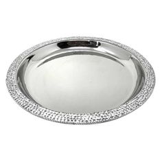 an oval silver tray with beading on the rim