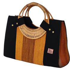 If you love elegant and classy handbags and love making a statement then this bag is for you! With sturdy and gorgeous cane handles and a stunning combination of colors from the Fugu fabric, the bag is practically royalty. The Fugu or Smock fabric is a luxury native fabric worn mostly by the royals of the Northern Tribes of Ghana. This bag also comes with an inner pocket with a zip fastening and provides lots of space, it's even big enough for a small laptop! As if that was not awesome enough, w Shopping Straw Bag With Bamboo Handle, Elegant Satchel Beach Bag With Handles, Black Shoulder Bag With Bamboo Round Handle, Black Shoulder Bag With Bamboo Handle For Travel, Black Travel Shoulder Bag With Bamboo Handle, Black Rectangular Shoulder Bag With Bamboo Handle, Eco-friendly Bag With Bamboo Circular Handle, Elegant Woven Top Handle Beach Bag, Eco-friendly Shoulder Bag With Bamboo Top Handle